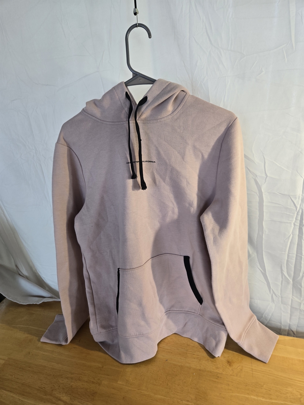 Hollister Men's Hooded Pullover in Light Dusty Pink with Black Accents